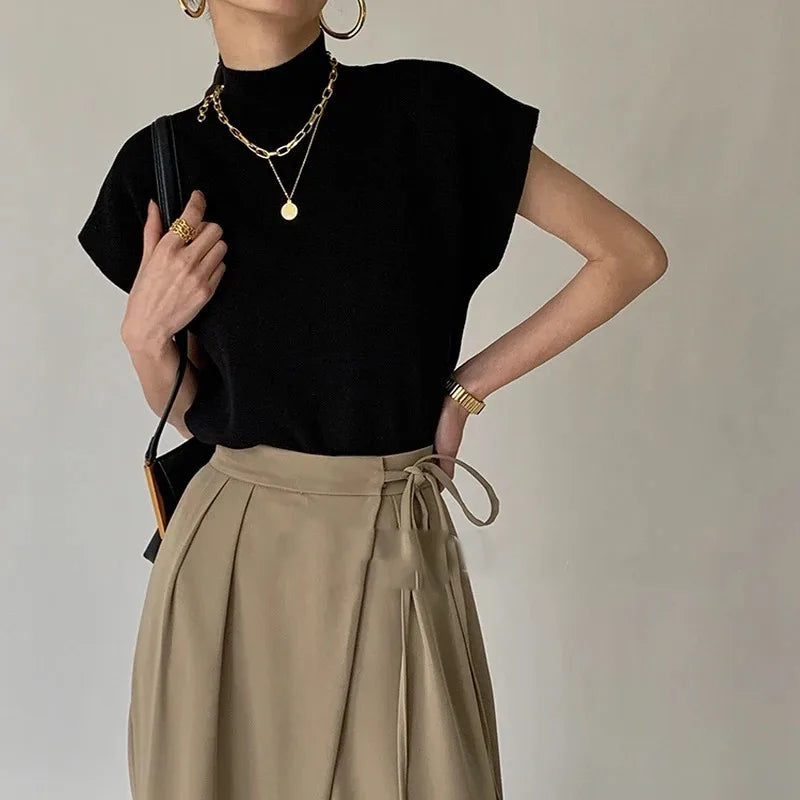 Blusa de punto con cuello alto, lisa, de manga corta