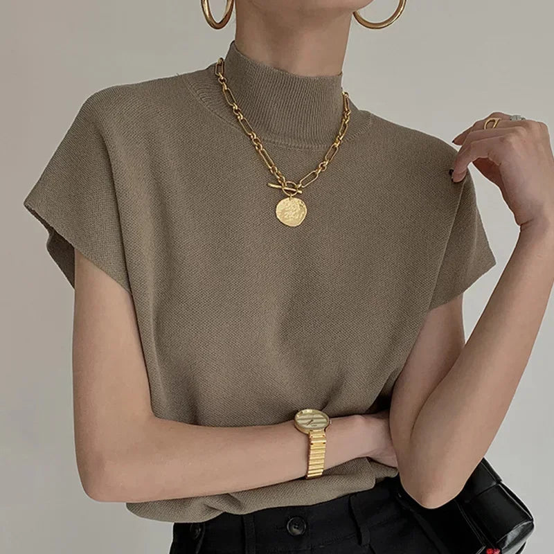 Blusa de punto con cuello alto, lisa, de manga corta