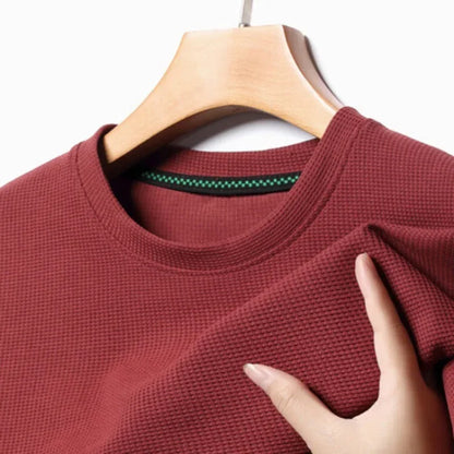 Polo liso tipo gofre de manga corta con cuello redondo para hombre